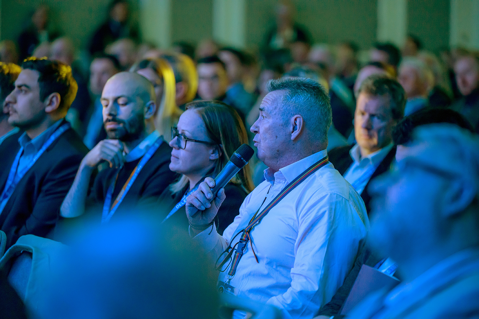 Delegates listening during a conference session